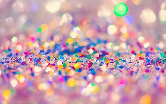 Colorful glitter background with bokeh effect