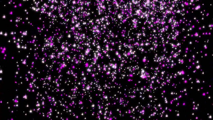 Purple and white glitter particles on black background