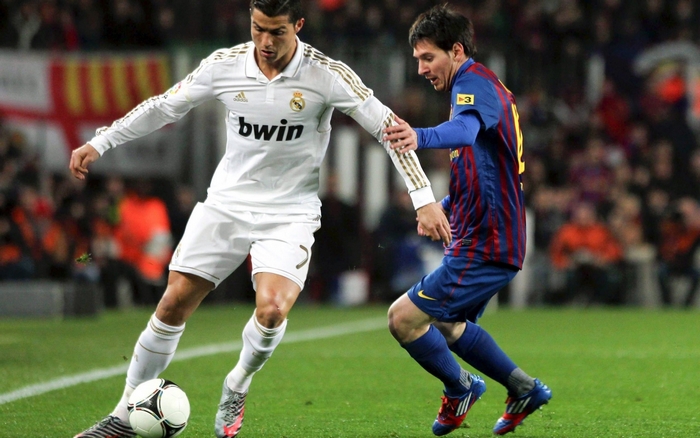 Cristiano Ronaldo and Lionel Messi playing soccer