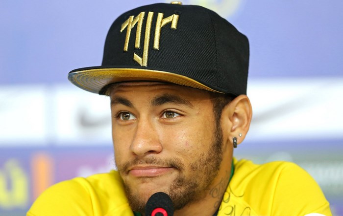 Neymar wearing a black and gold NJR cap