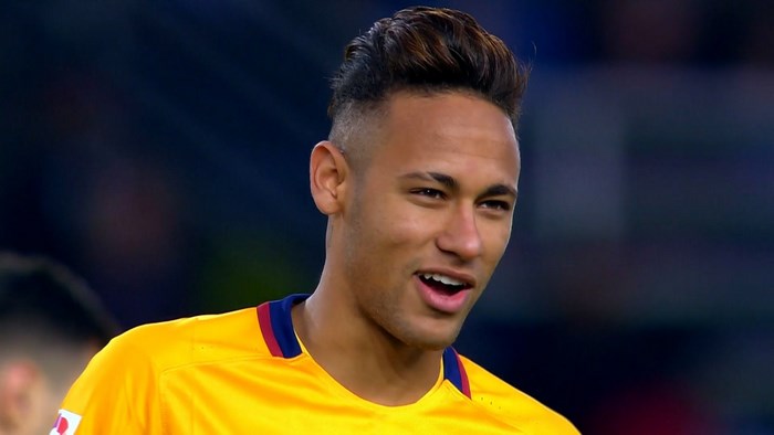 Neymar Jr. wearing a yellow Barcelona jersey