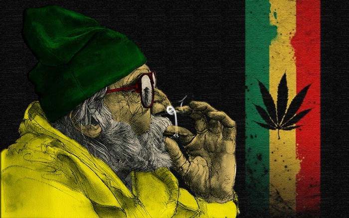Man in green hat smoking marijuana