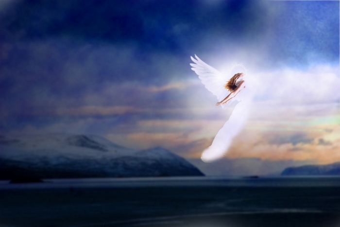Angel flying over a snowy landscape