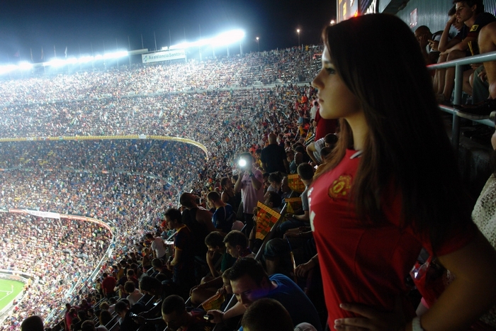 Woman in Manchester United jersey at stadium