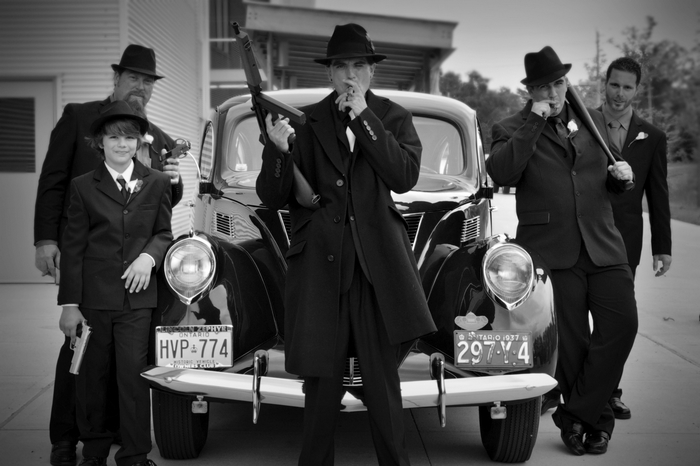 Gangsters with vintage car and weapons