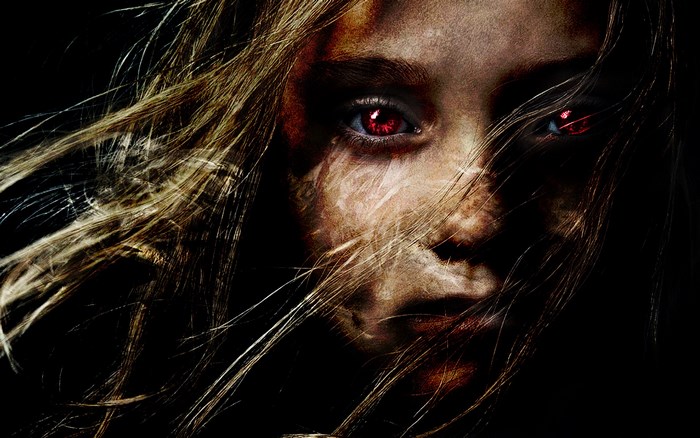 Girl with red eyes and messy hair