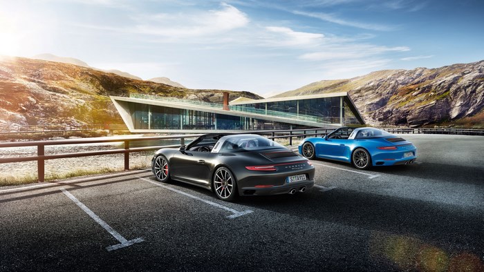 Porsche 911 Targa cars parked in a scenic mountain landscape