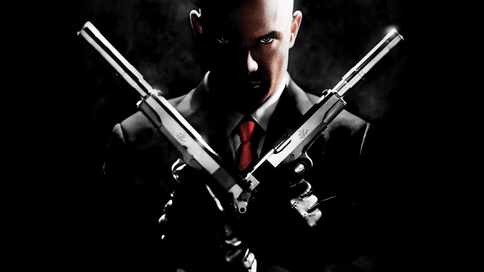 Agent 47 from Hitman holding two pistols