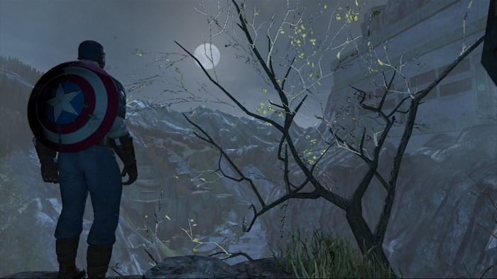 Captain America from Marvel standing on a cliff overlooking a valley