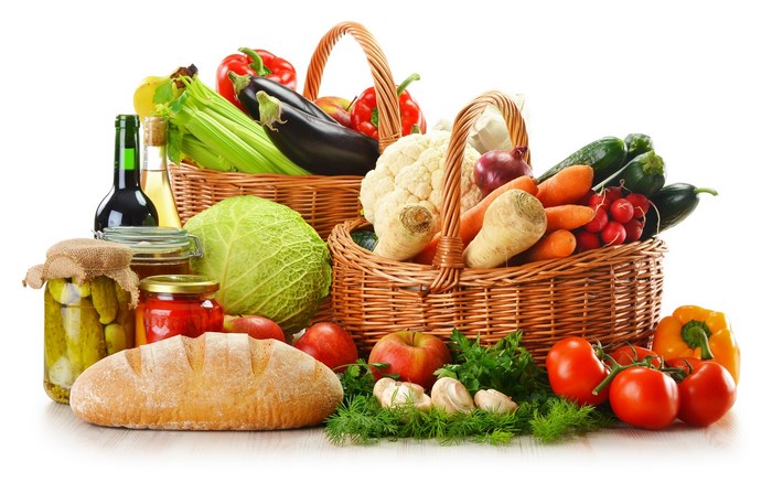 Assortment of fresh vegetables and bread in baskets