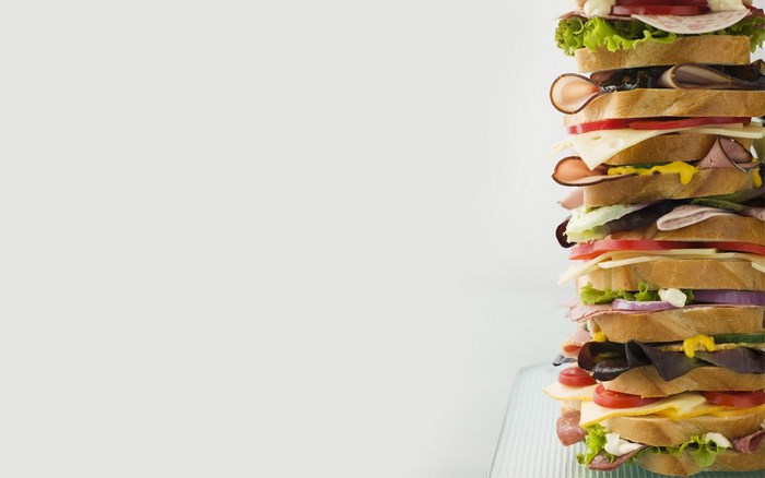 A very tall stacked sandwich with many layers