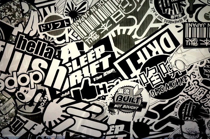 Sticker bomb with Japanese text and car graphics