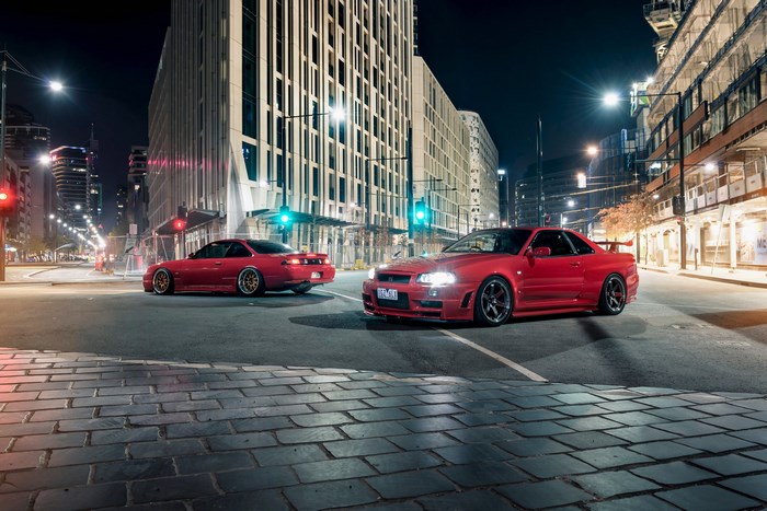 Red Nissan Silvia S14 and Nissan Skyline R34 at Night