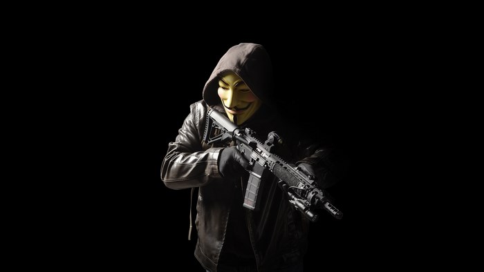 Anonymous Figure with Rifle in Dark Setting