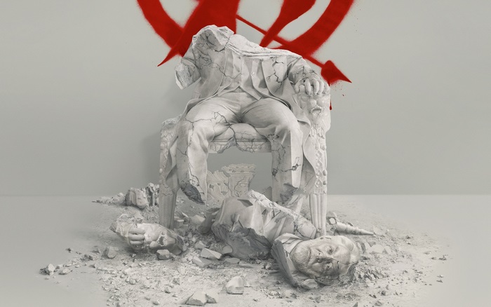The Hunger Games Mockingjay symbol and broken statue