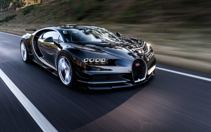 Sleek Black Bugatti Chiron Speeding on Road