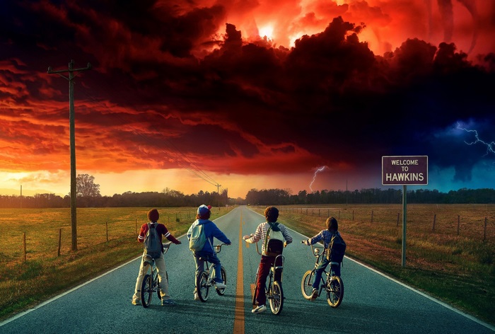 Stranger Things kids on bikes approaching Hawkins