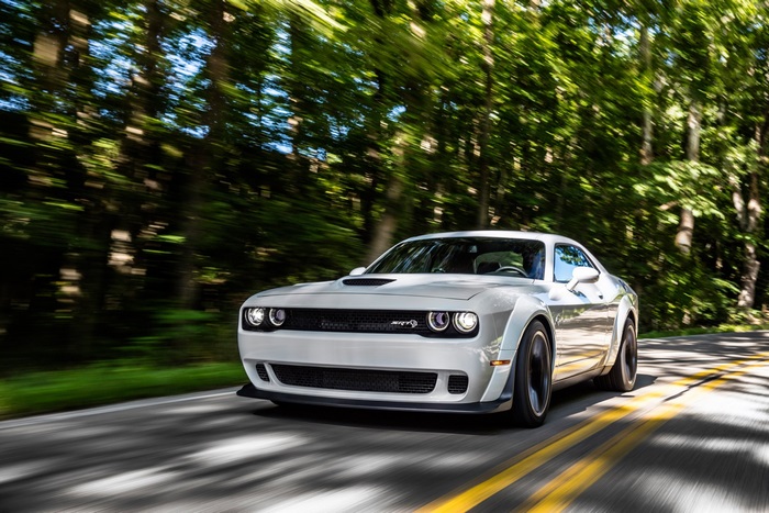 White Dodge Challenger SRT Hellcat Widebody driving on a road