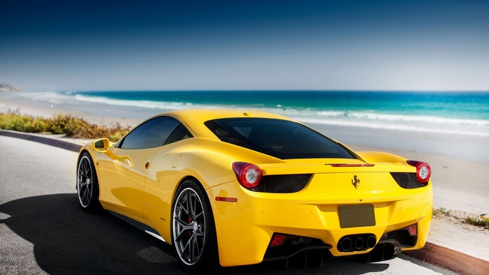 Yellow Ferrari 4K Sports Car by the Beach