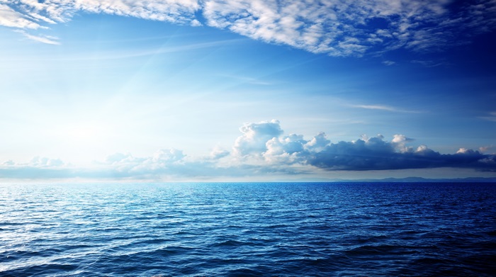 Calm Blue Sea Under Bright Sky 4K