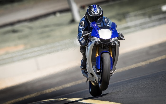 Yamaha R1 motorcycle doing a wheelie