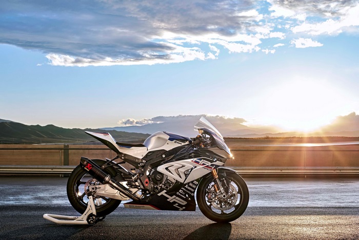 BMW HP4 Race motorcycle on a track at sunset