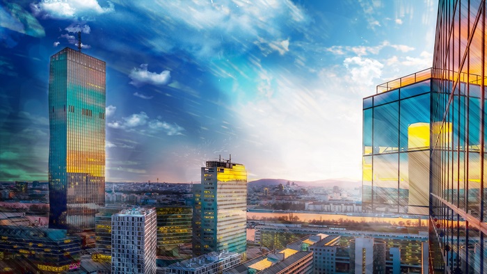 Modern skyscrapers in a city at sunset, 4K