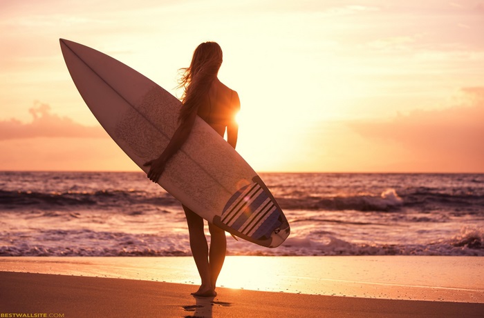 Surfer Woman at Sunset Holding Surfboard 4K
