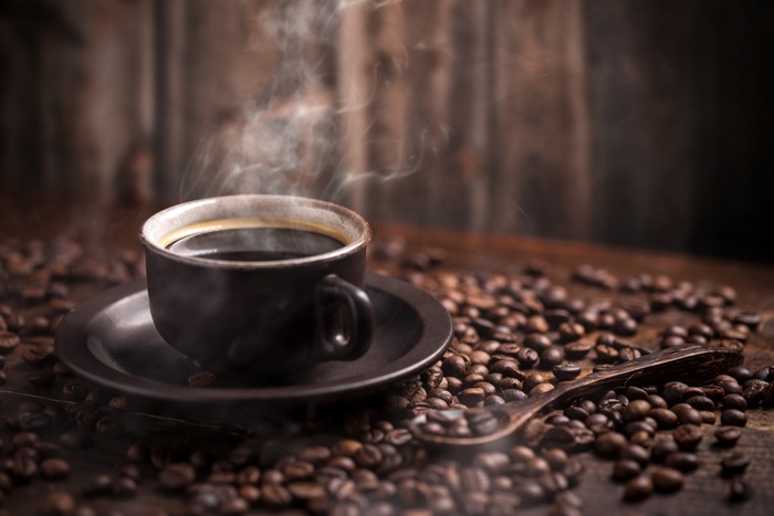 Steaming Hot Coffee Cup with Coffee Beans 4K