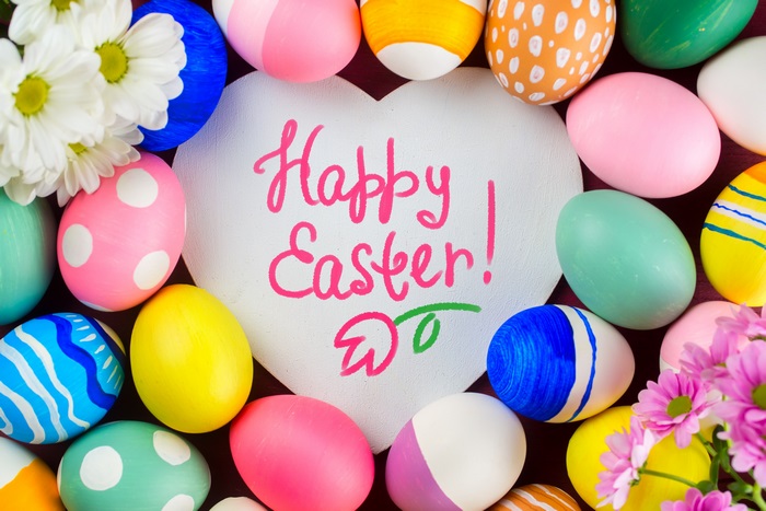Happy Easter decorated eggs and flowers