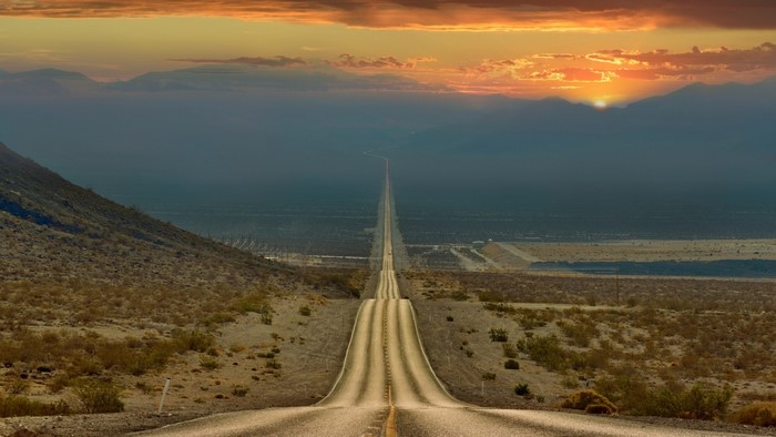 Desert highway at sunset in California, USA