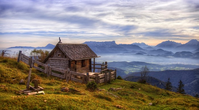 Misty Sunrise Over Salzburg Mountain Cabin