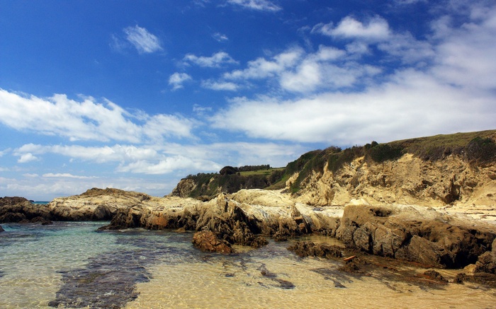Rocky coastline with clear water and blue sky