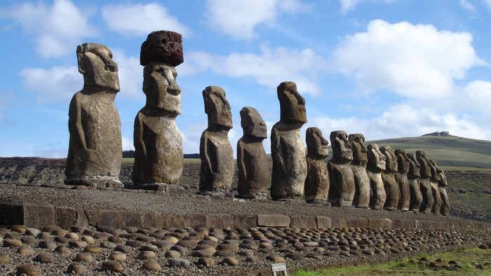 Moai statues on Easter Island under a cloudy sky