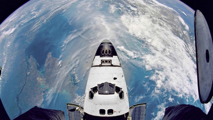 Space Shuttle Atlantis over Earth