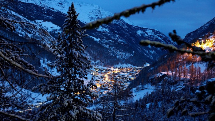 Winter Evening Village in Swiss Alps Valley