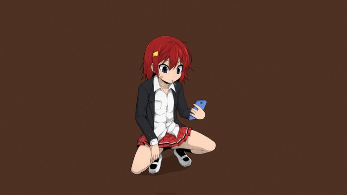 Girl with red hair holding a phone