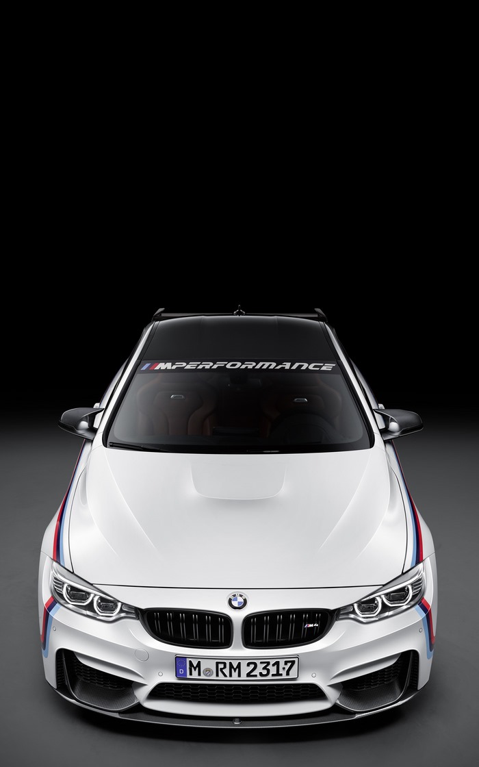 White BMW M4 with M Performance Banner