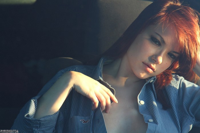 Redhead woman in open shirt