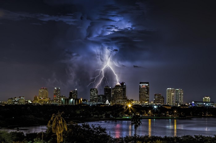Lightning strikes Tampa, Florida cityscape at night