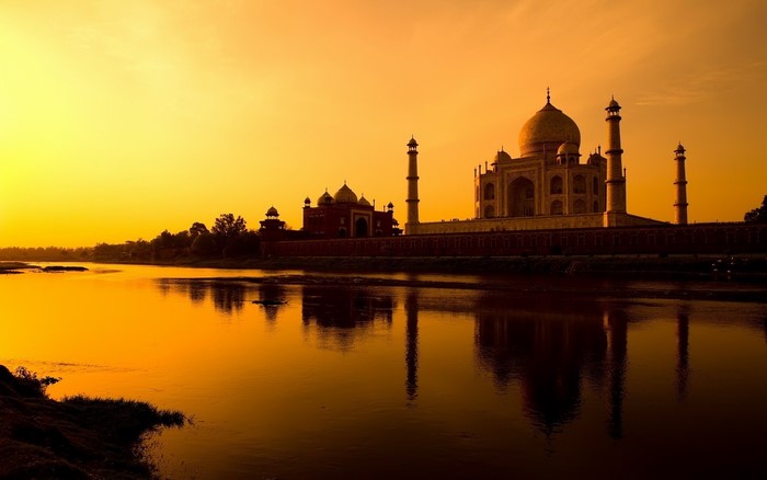 Taj Mahal at sunset with river reflection