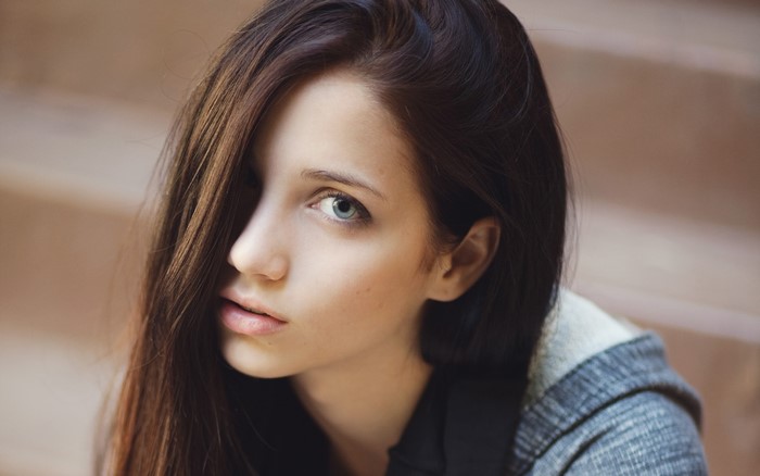 Emily Rudd brunette with hair in face