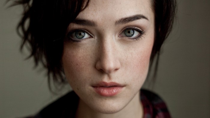 Woman with short brown hair and blue eyes