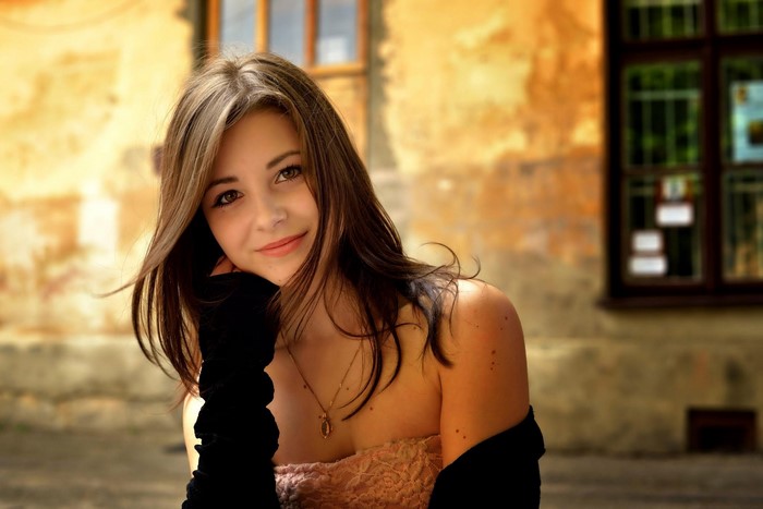 Portrait of a Smiling Young Woman in Warm Light