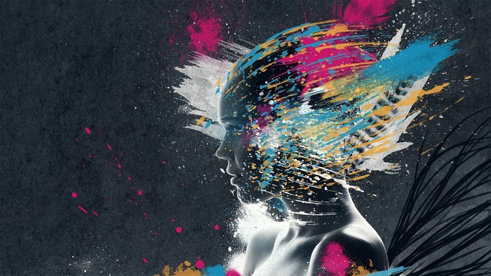 Woman's face with colorful paint splatters
