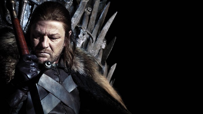 Ned Stark from Game of Thrones sitting on the Iron Throne