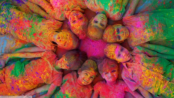 Children covered in colorful powder during Holi festival