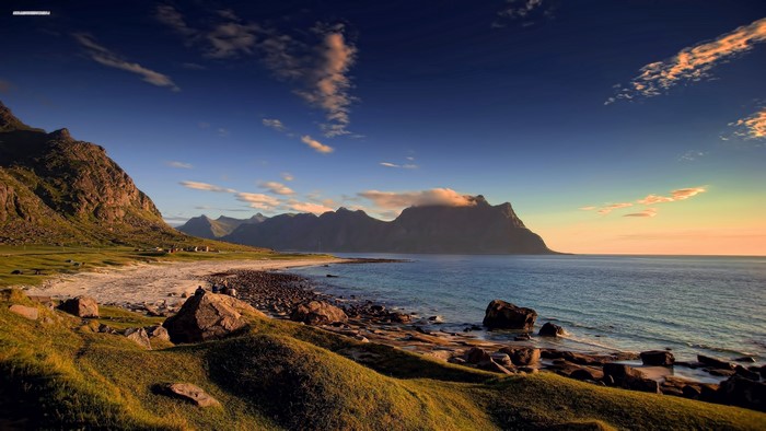 Coastal mountains and beach at sunset