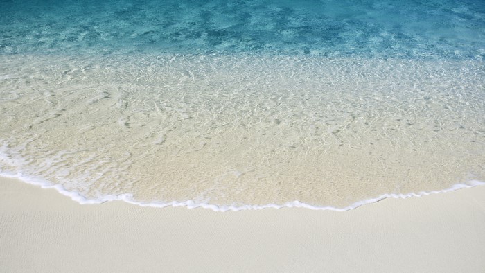 Ocean waves on a sandy beach