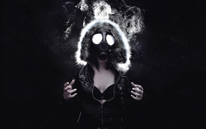 Woman in gas mask with smoke and fur hood